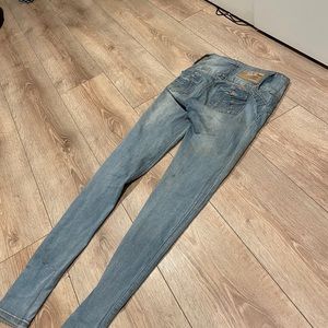 Blue skinny jeans with designs